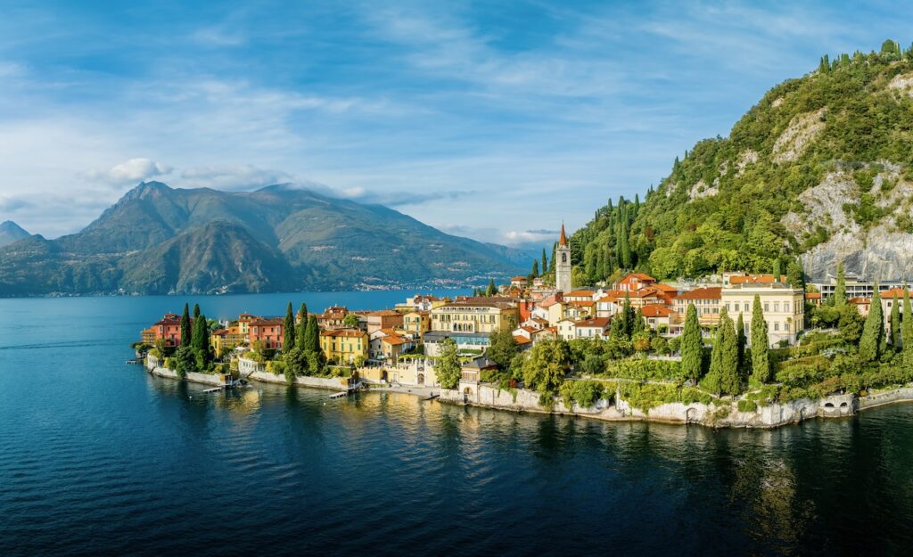 Colorful lakeside village of Varenna on Lake Como with mountains in the background.