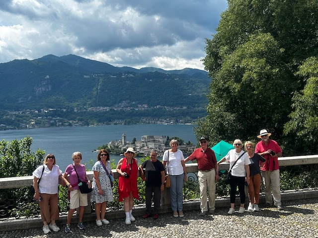Small Group Tour on Lake Como – Italian Lakes Tour 2026 Guests on our Italian Lakes small group tour overlooking Isola San Giulio on Lake Orta.