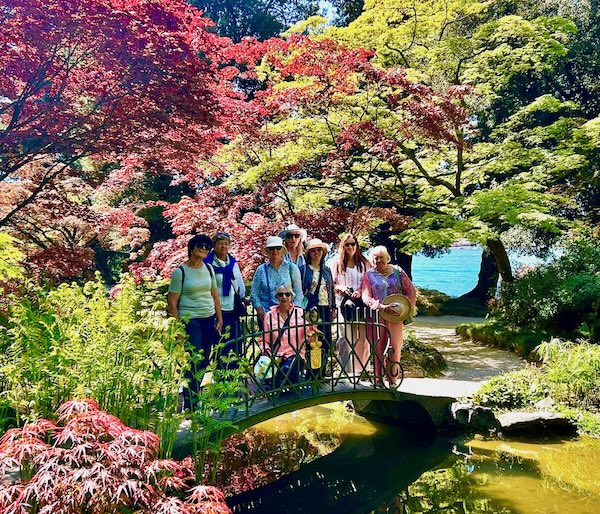 Guests are enjoying a garden visit on the Italian Garden Tour.